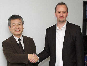 Lancaster's head of department shakes hands with a visitor from Kyoto University